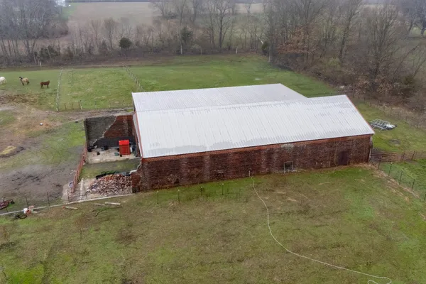 a room with pool table and chairs