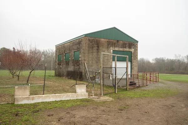 a view of a field with an ocean