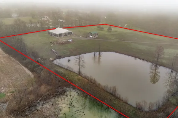 a aerial view of a house with a yard