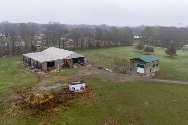 a view of a backyard with chairs