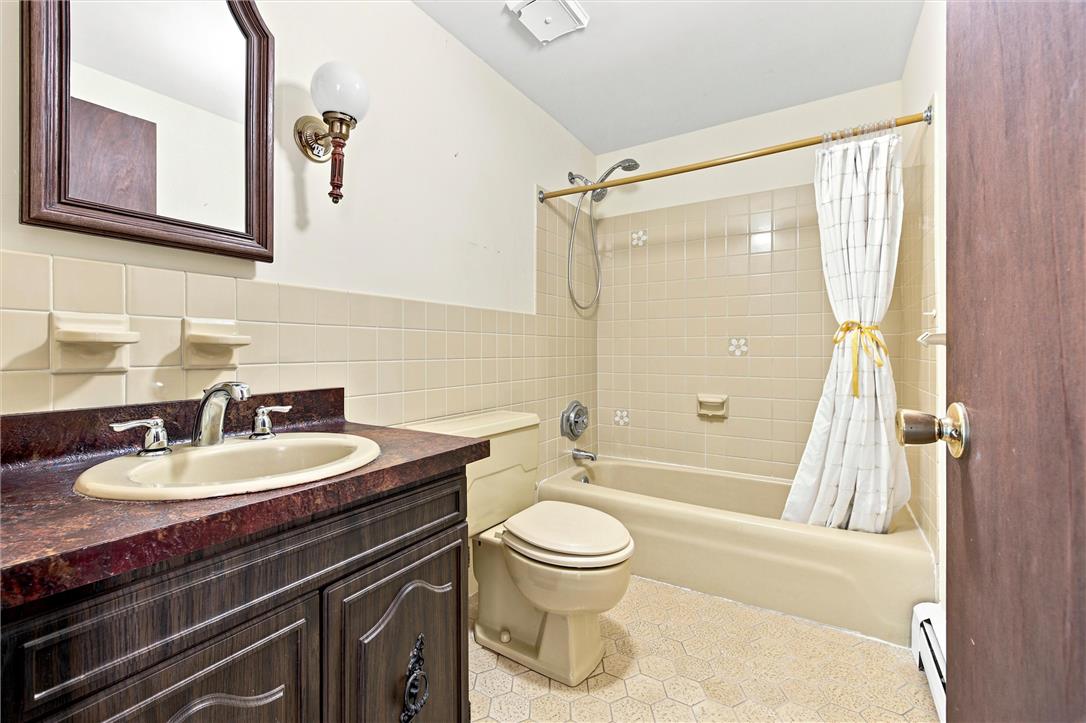 475 Crowthers Road Quakertown, PA 18951 - Photo 45 of 93 Functional full bathroom with an integrated tub and shower, featuring a single vanity and tiled walls.