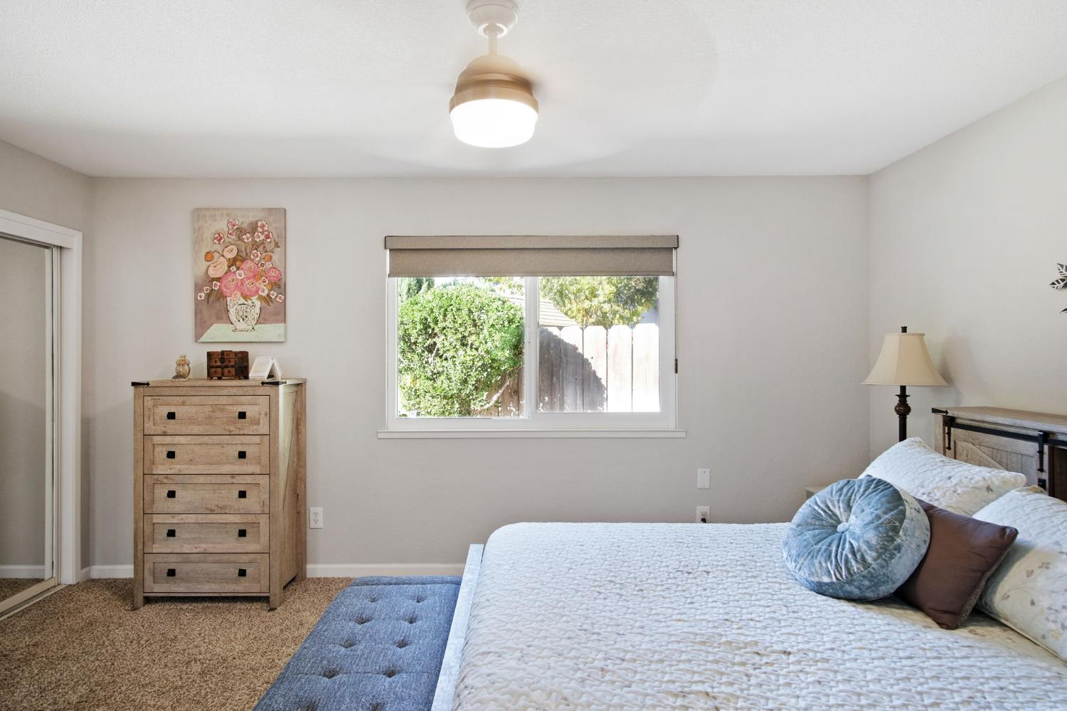 3161 Bridgeport Court Turlock, CA 95382 - Photo 12 of 31 a bedroom with a bed and a dresser