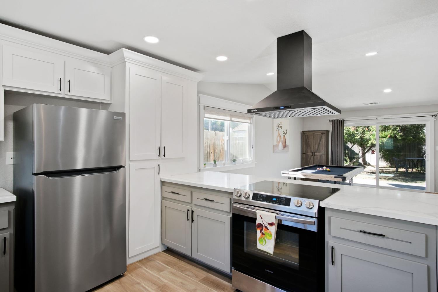 3161 Bridgeport Court Turlock, CA 95382 - Photo 20 of 31 a kitchen with stainless steel appliances a sink stove and refrigerator