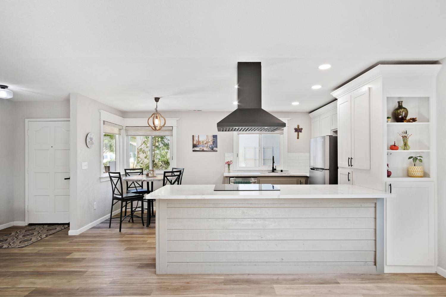 3161 Bridgeport Court Turlock, CA 95382 - Photo 26 of 31 a view of kitchen with refrigerator stove dining table and chairs