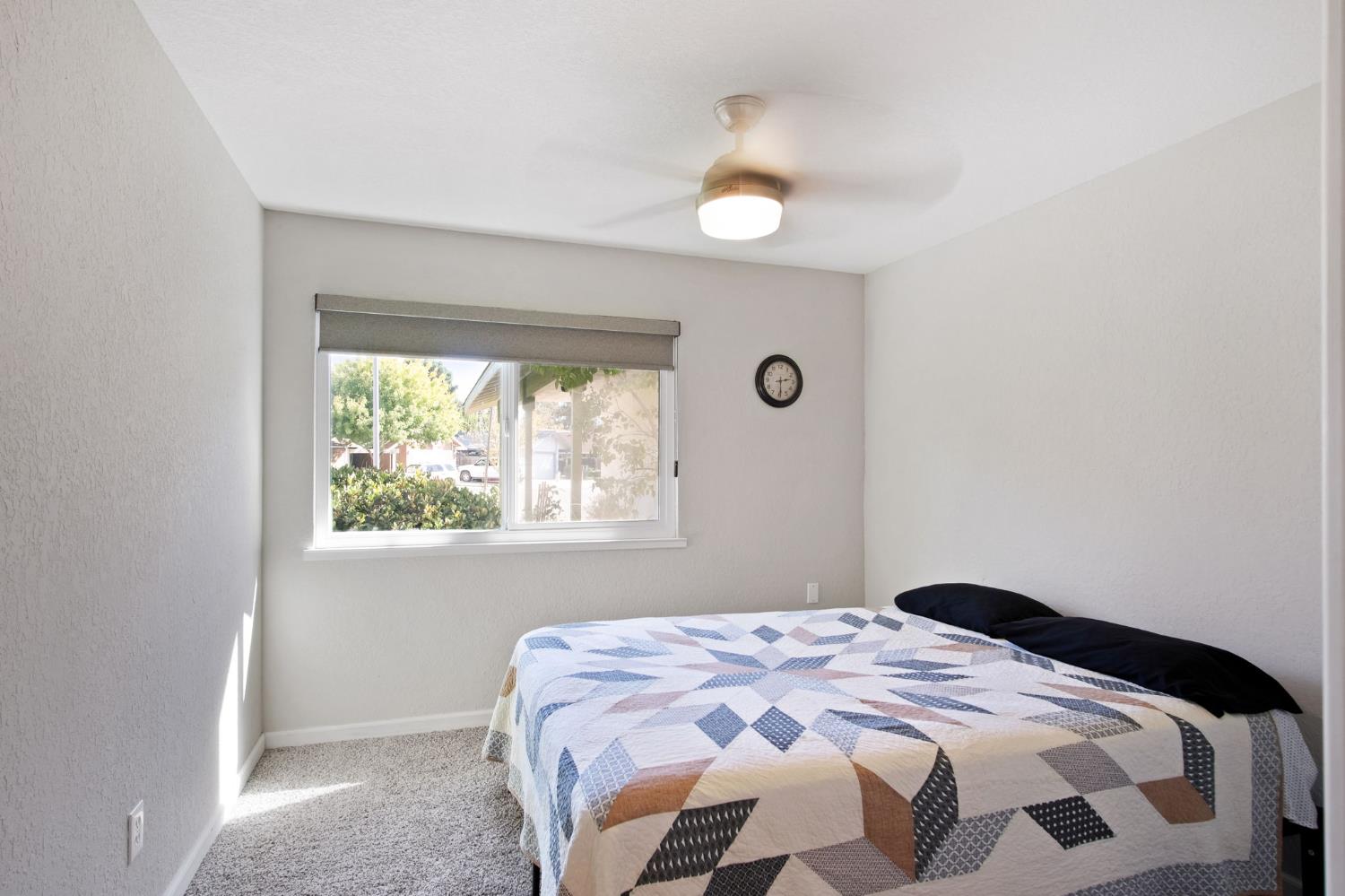 3161 Bridgeport Court Turlock, CA 95382 - Photo 7 of 31 a bedroom with a bed and a window