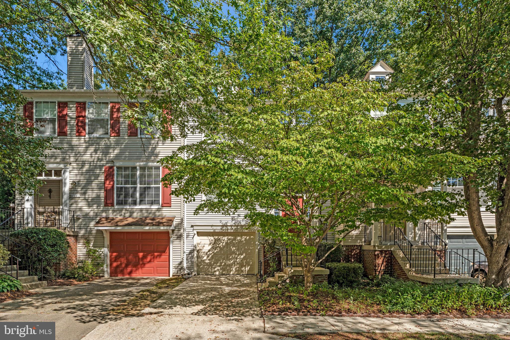 5803 Walden Commons Court Burke, VA 22015 - Photo 15 of 20 a front view of a house with a yard