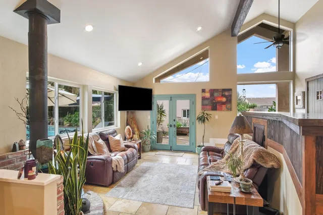 a kitchen with stainless steel appliances a stove a sink and cabinets