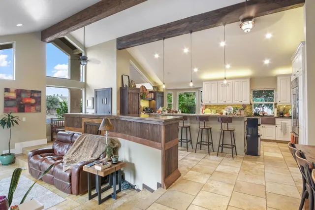 a kitchen with stainless steel appliances granite countertop a stove and a sink
