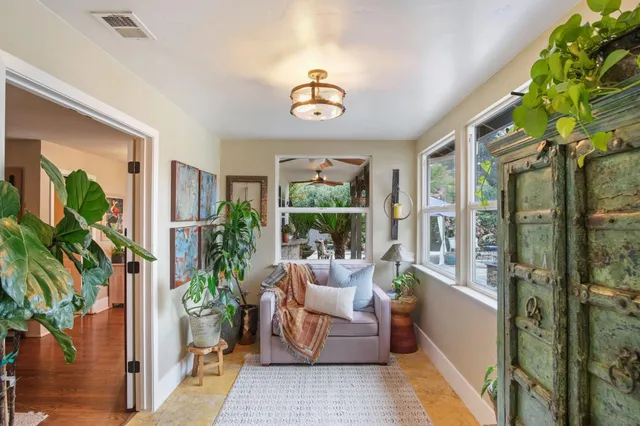 a bedroom with furniture and a chandelier