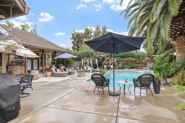 a room with furniture a rug and a fireplace