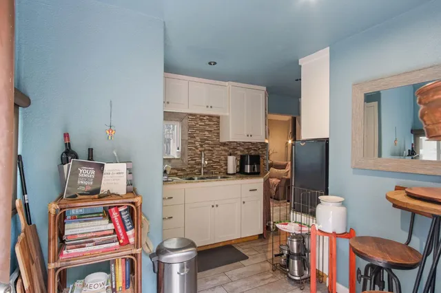 a view of a house with a yard and garage
