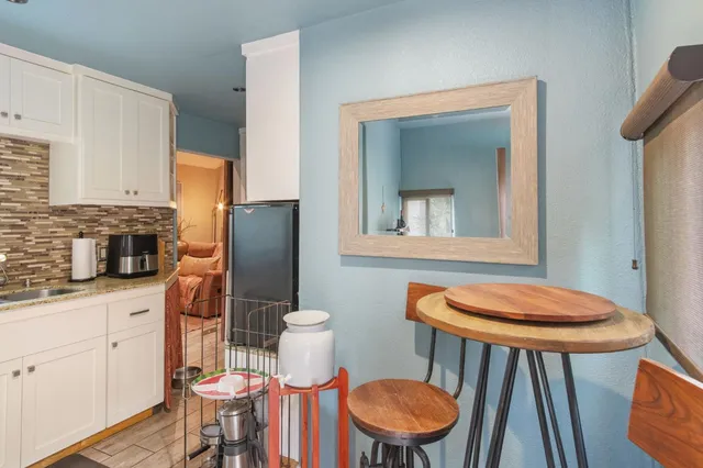 a view of a outdoor space with a house in the background