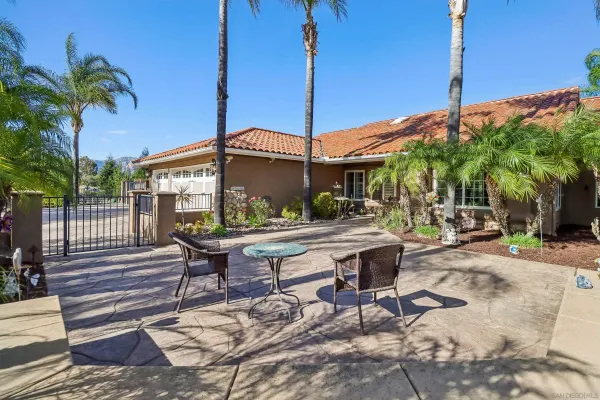 a view of a backyard with a patio