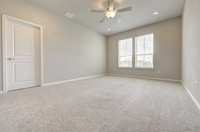 a kitchen with granite countertop a stove top oven sink and cabinets