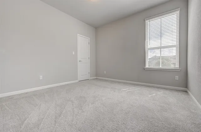 a bathroom with a sink a toilet a mirror and shower