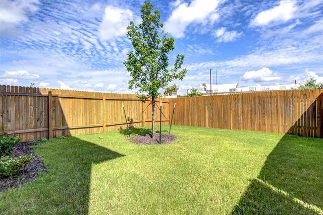 a swimming pool with some trees in the background