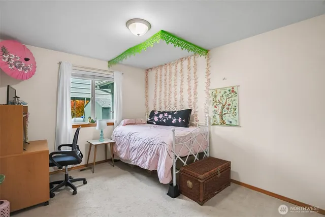 a bedroom with a bed and a dresser