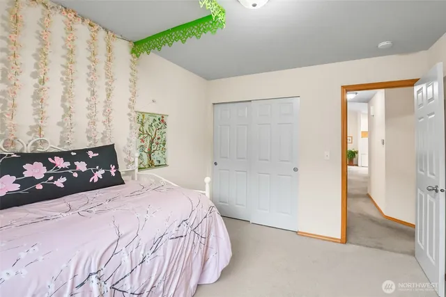 a view of a hallway with wooden shelves