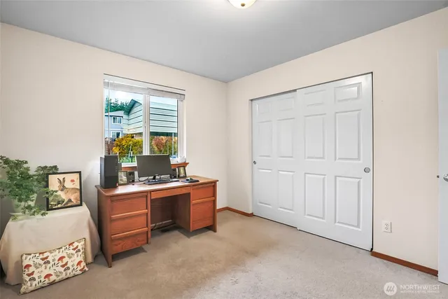 a bathroom with a toilet a sink and a mirror