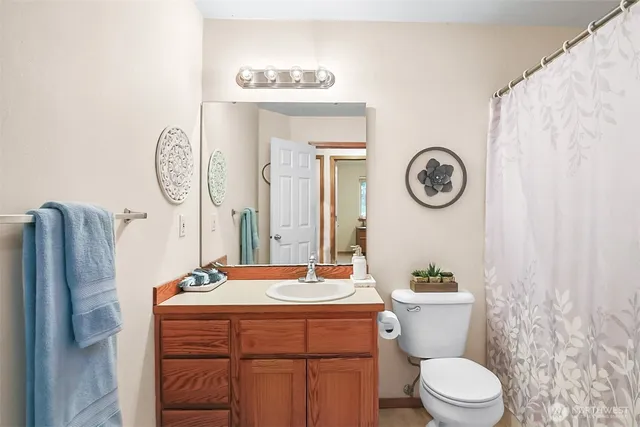 a bedroom with bed and a couch