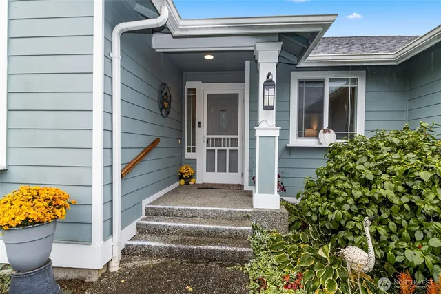 a view of front door of house with stairs