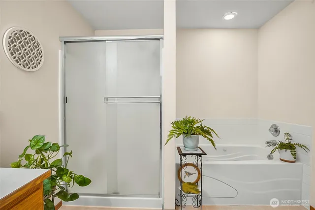 a view of a house with a big yard and potted plants