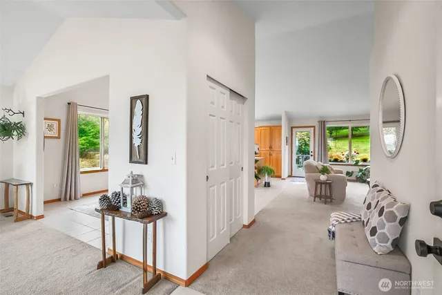 a living room with furniture a window and a dining table