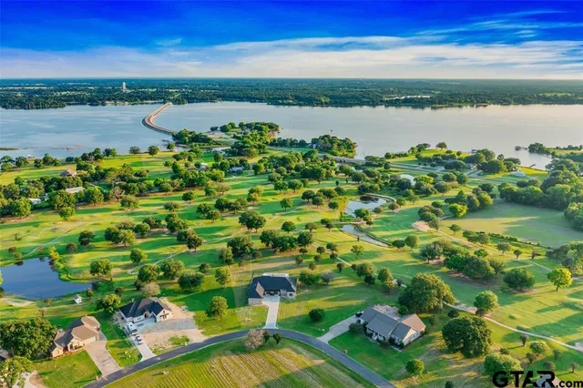 a view of lake with green space