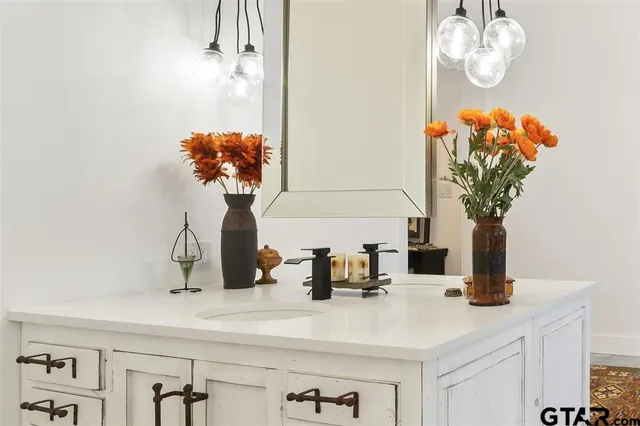 a table with a vase of flowers sitting on a table