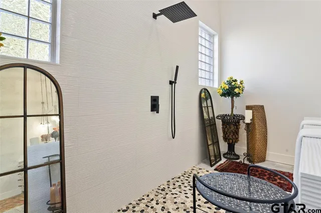 a room with furniture and a mirror