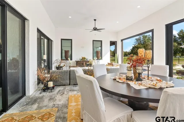 a view of a dining room with furniture wooden floor and chandelier