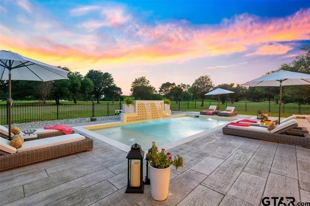 a view of swimming pool with lounge chair