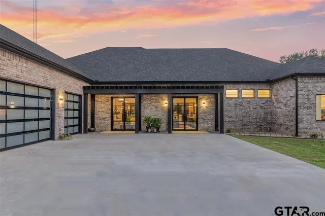 a front view of a house with a garage