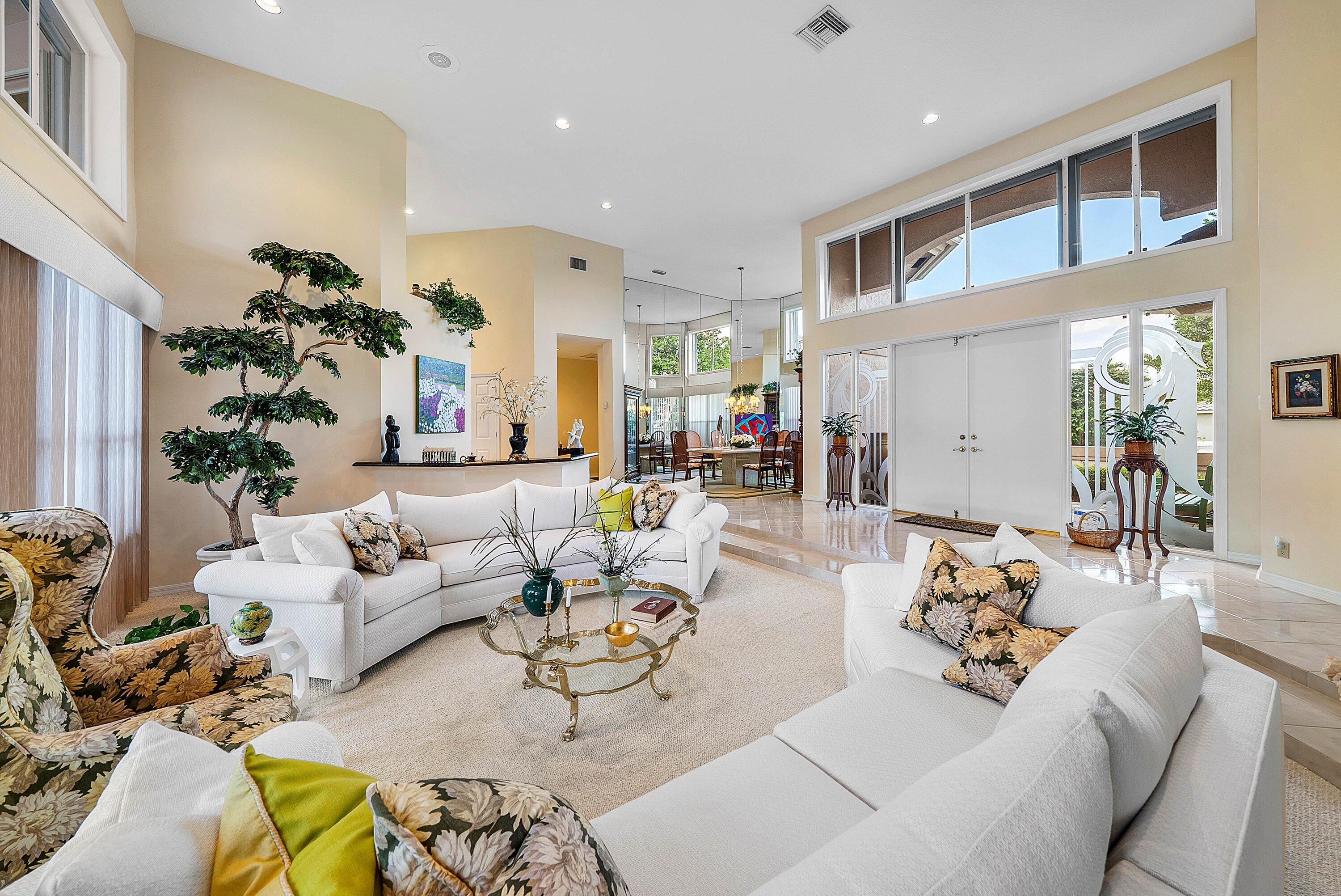 7142 Montrico Drive Boca Raton, FL 33433 - Photo 11 of 59 a living room with furniture kitchen view and a potted plant