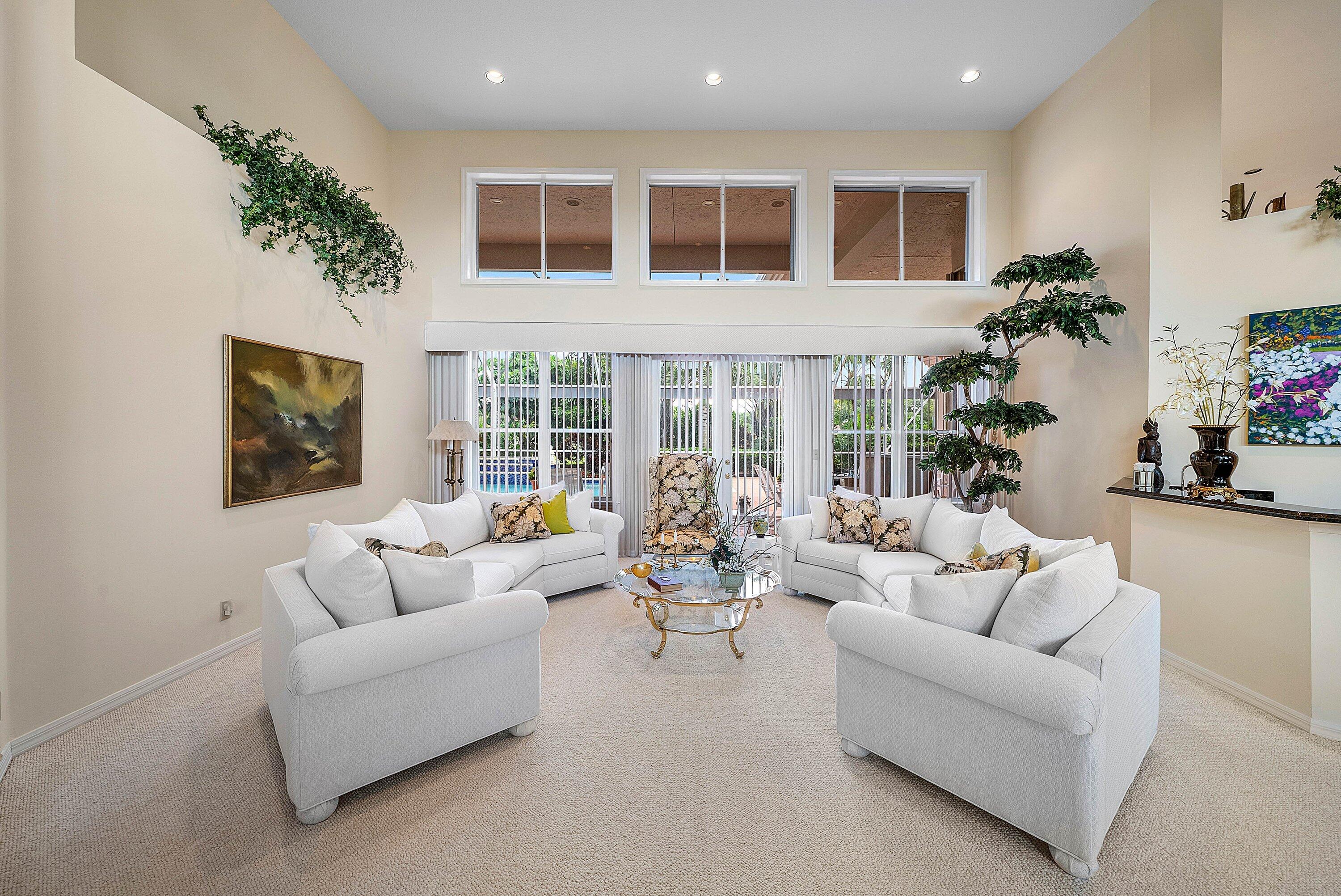 7142 Montrico Drive Boca Raton, FL 33433 - Photo 12 of 59 a living room with furniture and potted plants