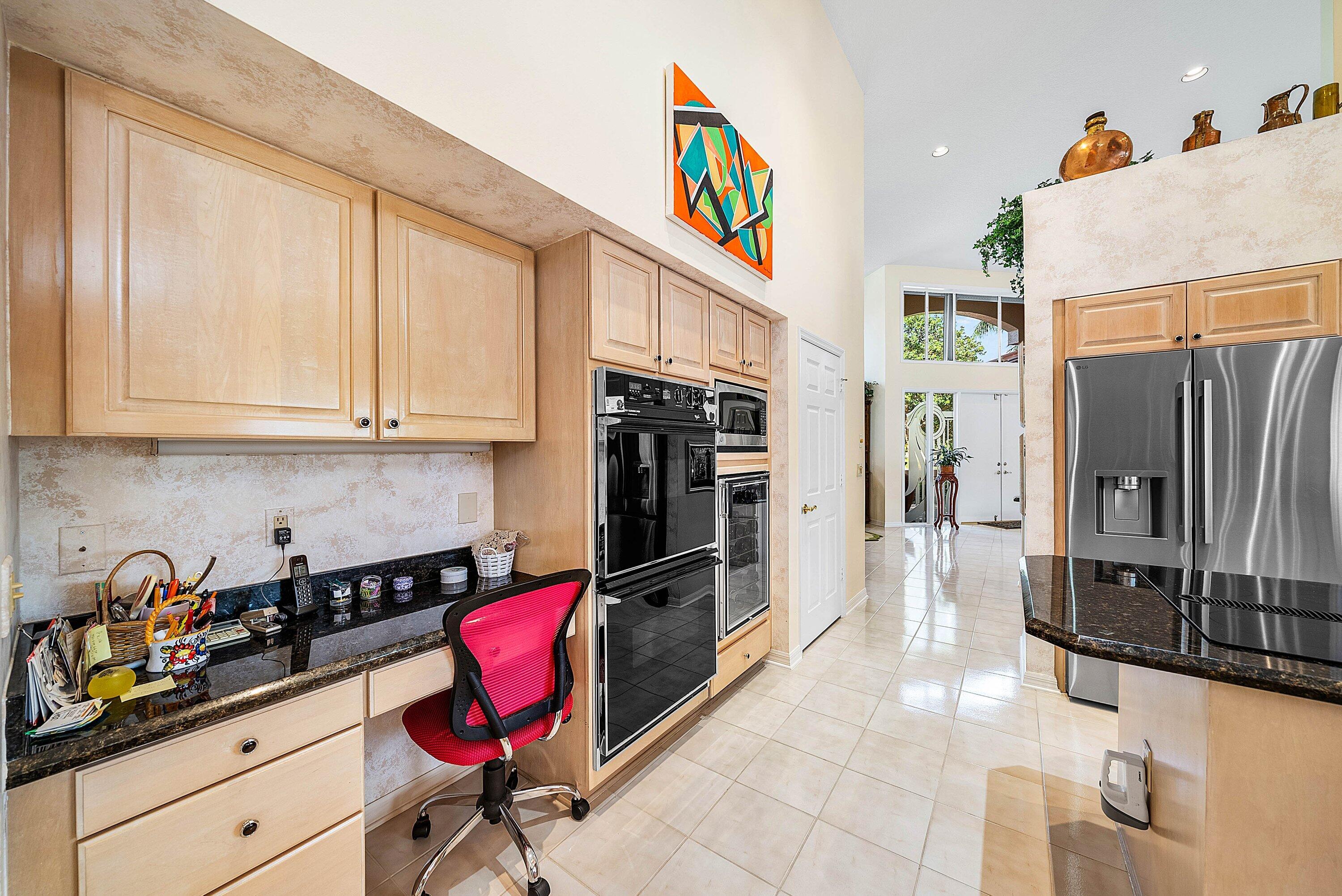 7142 Montrico Drive Boca Raton, FL 33433 - Photo 19 of 59 a kitchen with stainless steel appliances granite countertop a refrigerator and a stove
