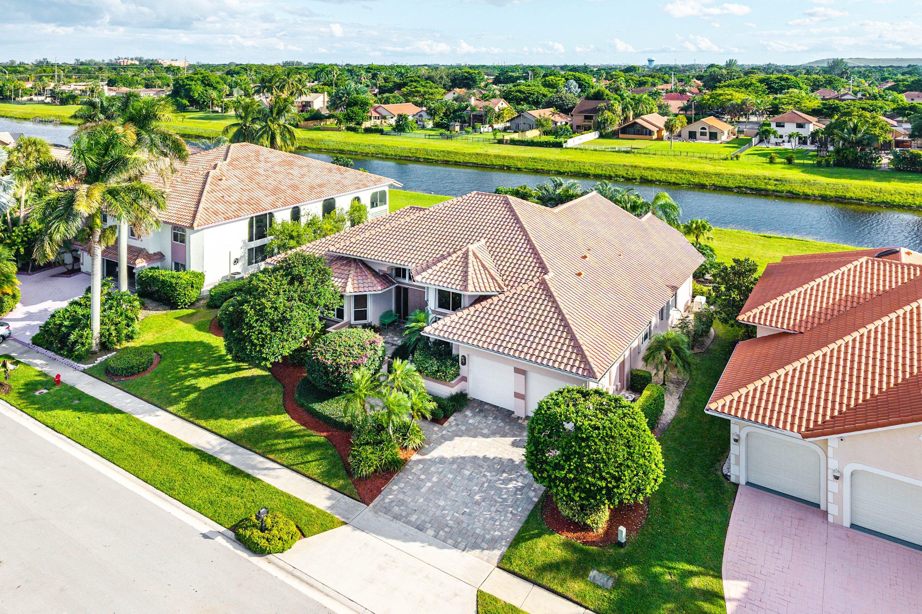 7142 Montrico Drive Boca Raton, FL 33433 - Photo 2 of 59 a view of a garden with an ocean view