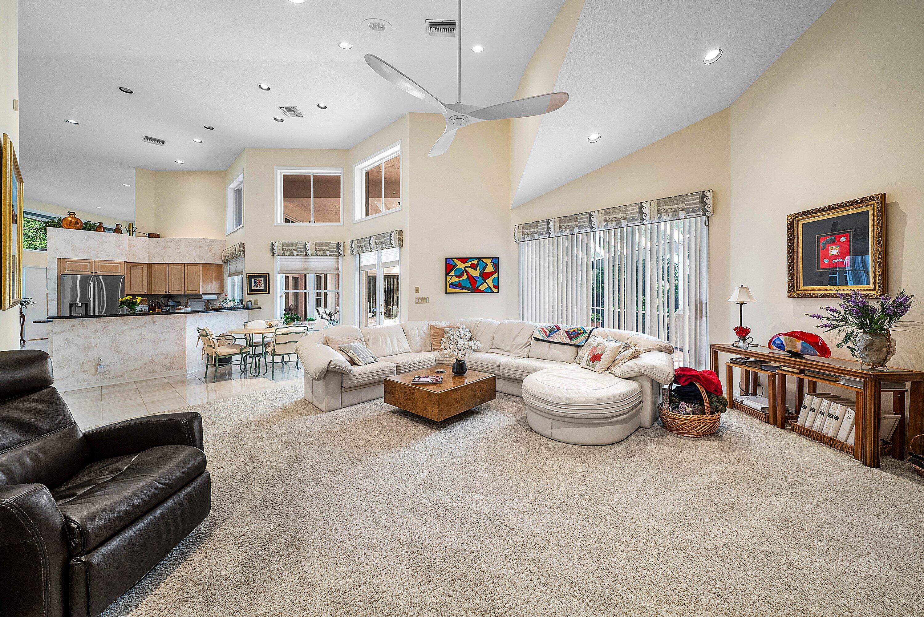 7142 Montrico Drive Boca Raton, FL 33433 - Photo 23 of 59 a living room with furniture and a chandelier