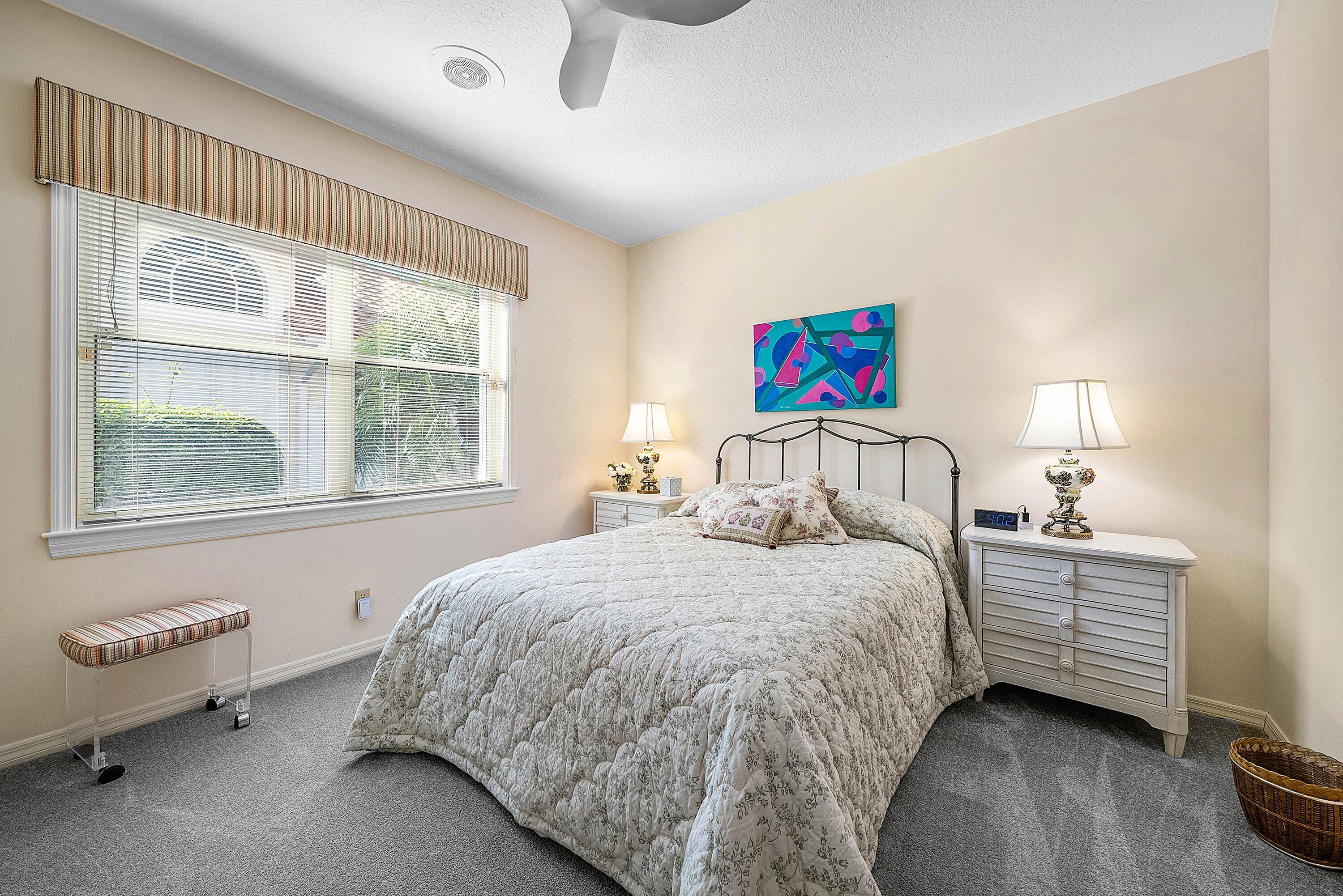 7142 Montrico Drive Boca Raton, FL 33433 - Photo 28 of 59 a bedroom with a bed and a large window