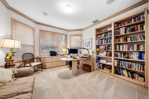 a spacious bedroom with a bed and a couch