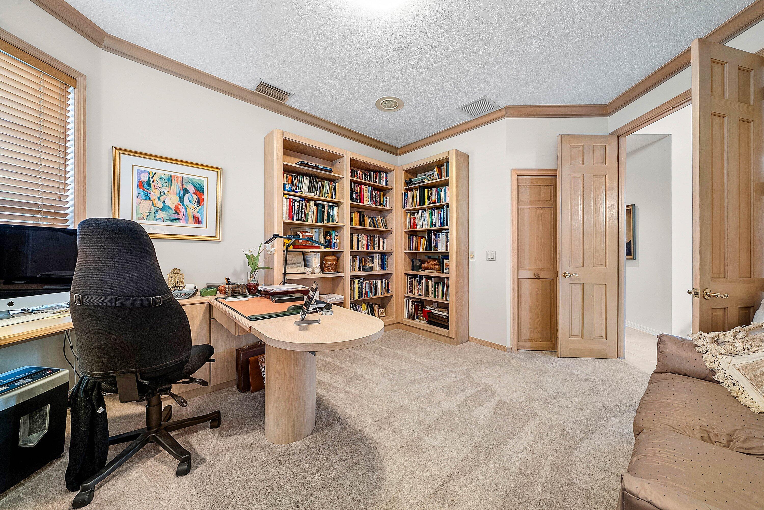 7142 Montrico Drive Boca Raton, FL 33433 - Photo 31 of 59 a workspace with a couch and a bookshelf
