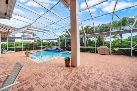 an aerial view of a house with a swimming pool