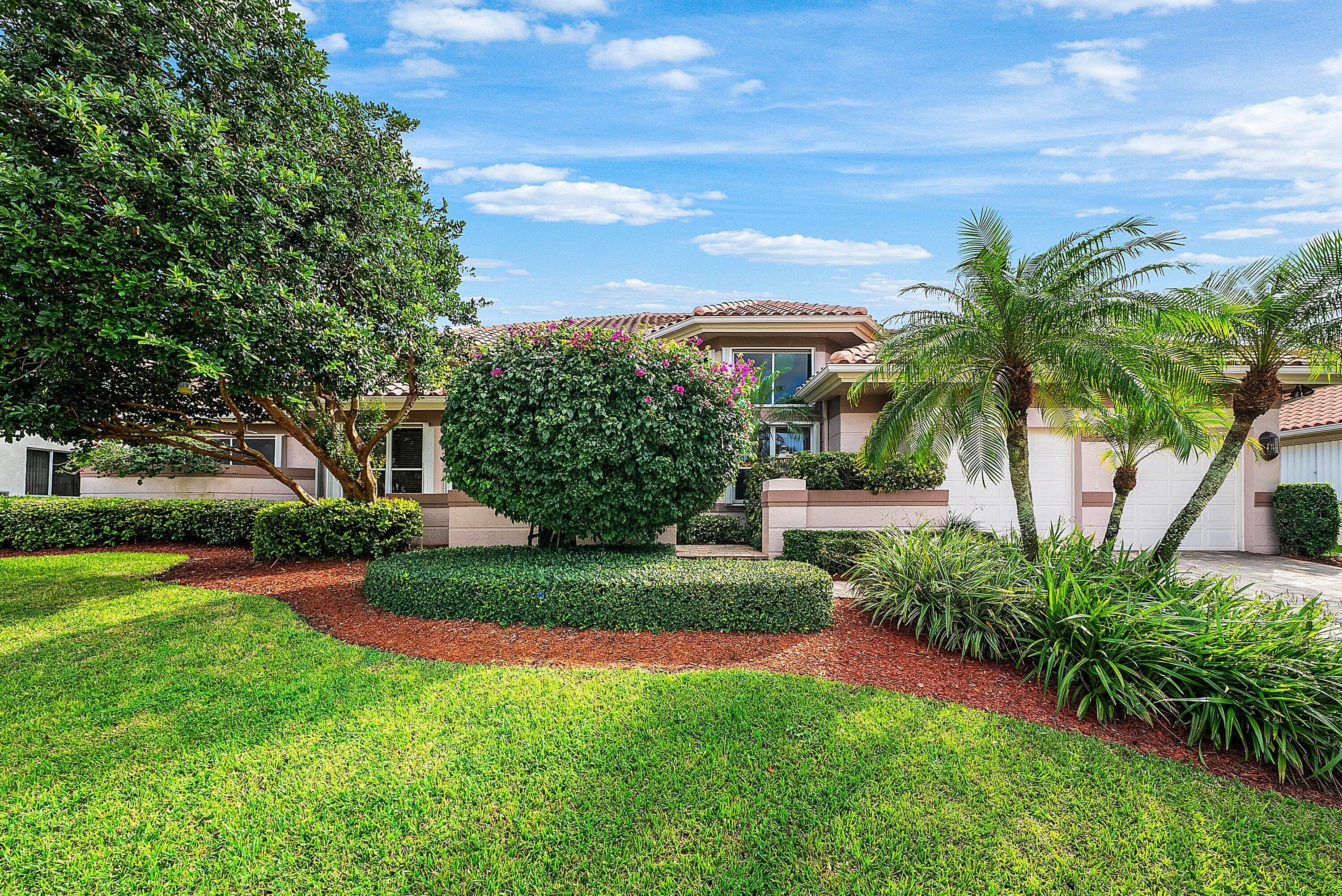 7142 Montrico Drive Boca Raton, FL 33433 - Photo 4 of 59 a view of a house with a yard