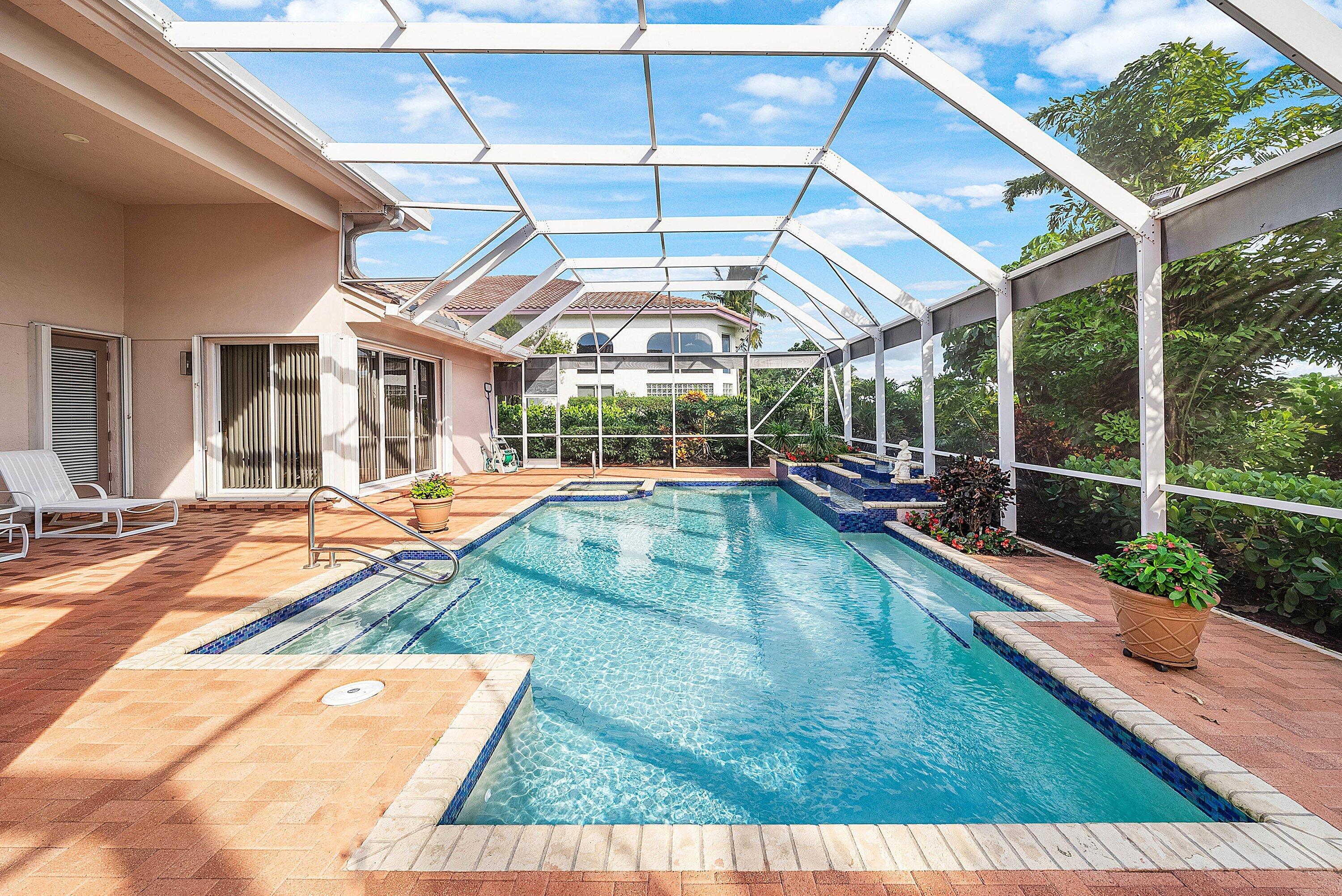 7142 Montrico Drive Boca Raton, FL 33433 - Photo 41 of 59 a view of a patio with a table and chairs