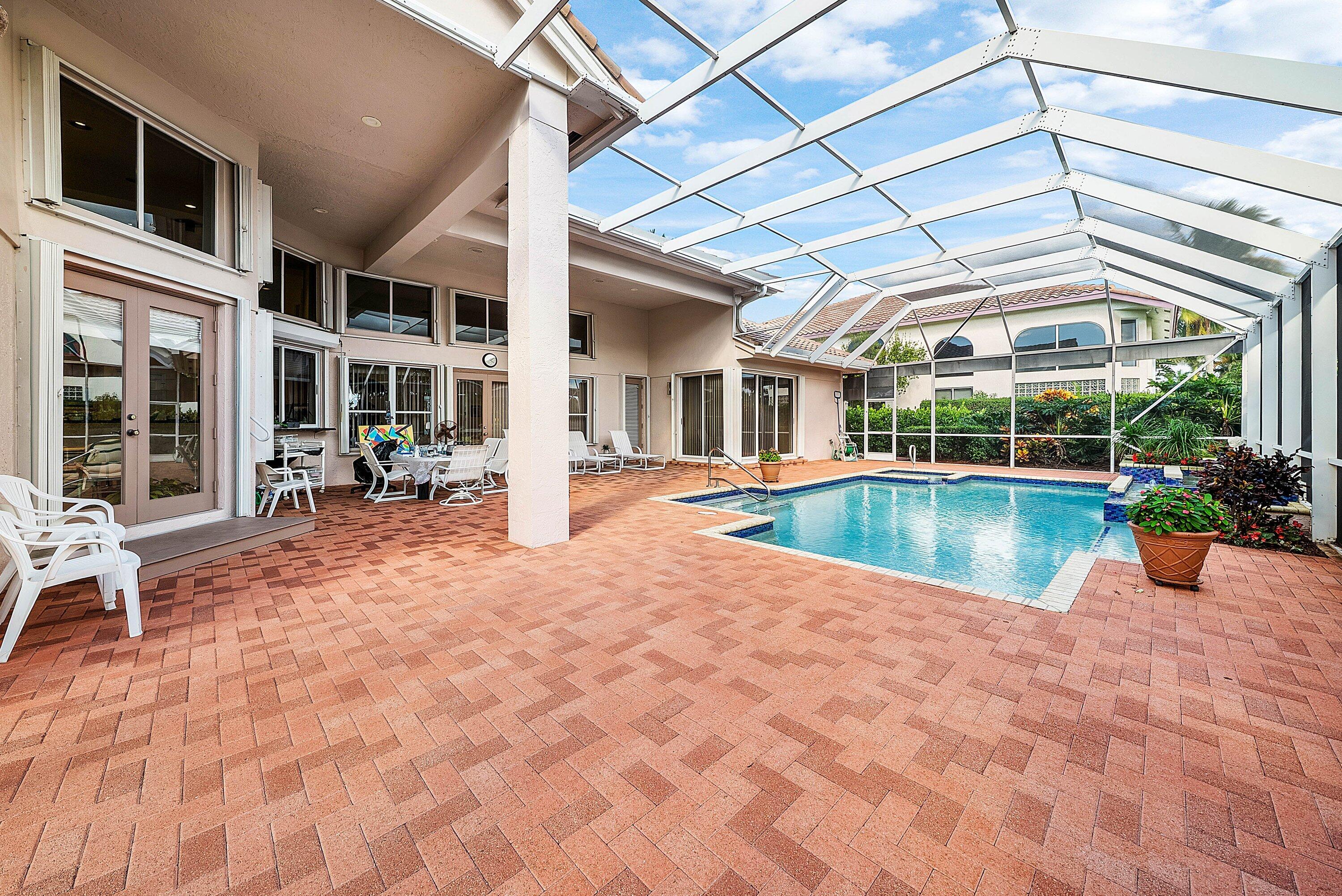 7142 Montrico Drive Boca Raton, FL 33433 - Photo 46 of 59 a view of a house with swimming pool and sitting area
