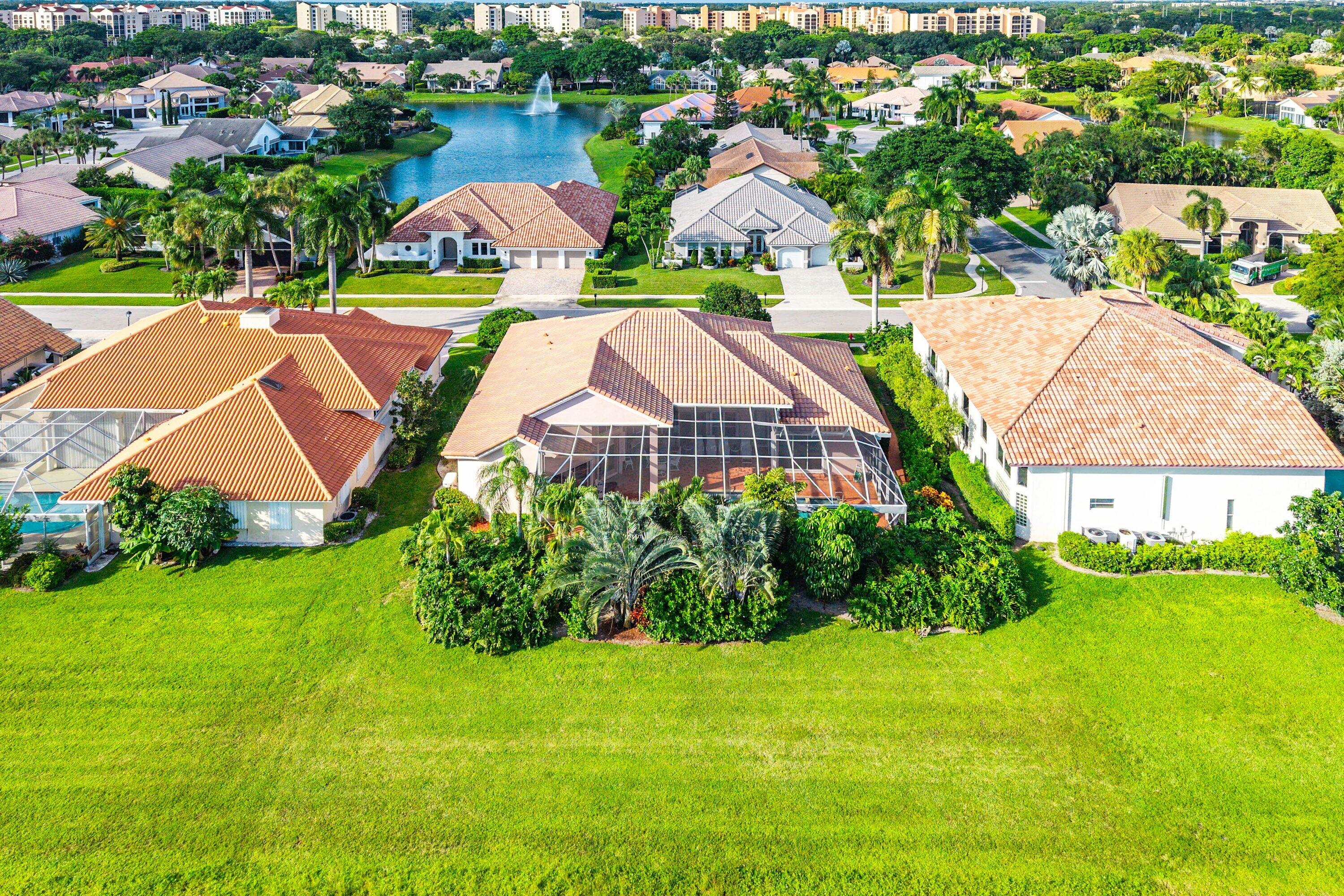 7142 Montrico Drive Boca Raton, FL 33433 - Photo 48 of 59 an aerial view of a house with garden space and lake view