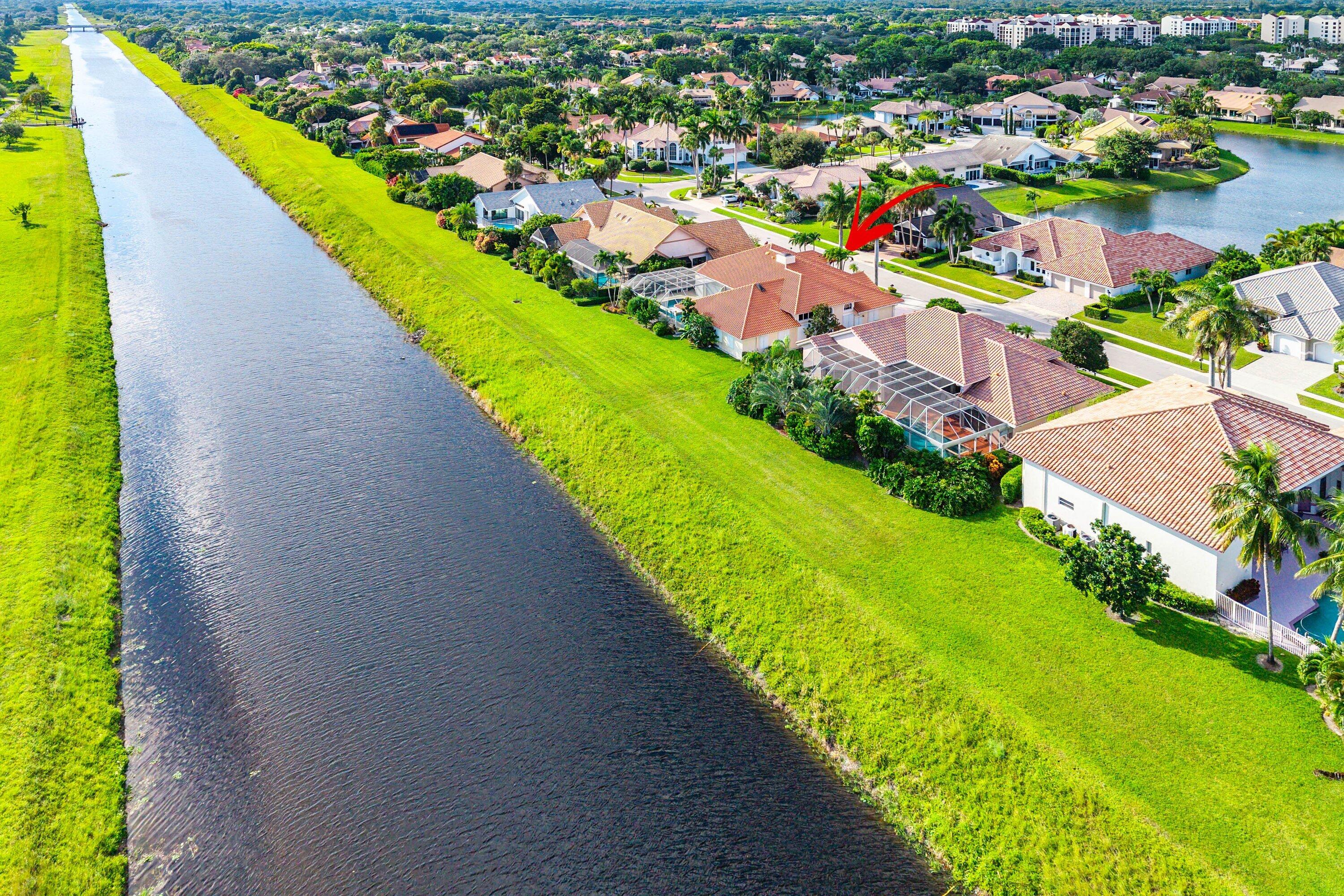 7142 Montrico Drive Boca Raton, FL 33433 - Photo 51 of 59 a view of a lake with a city