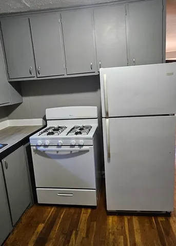 a bathroom with a sink and a microwave