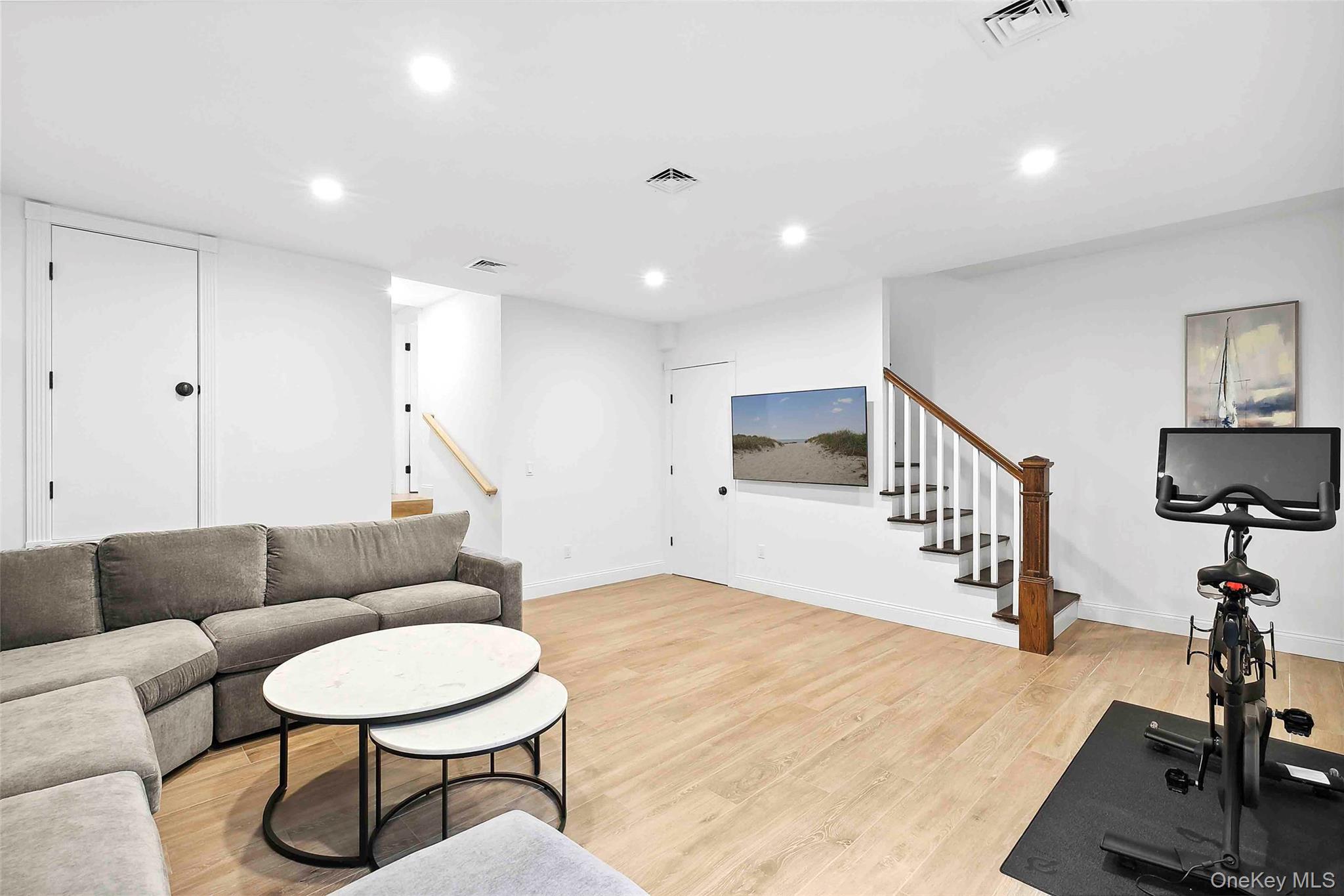 96 Miller Road Southampton, NY 11968 - Photo 11 of 18 a living room with furniture and a wooden floor