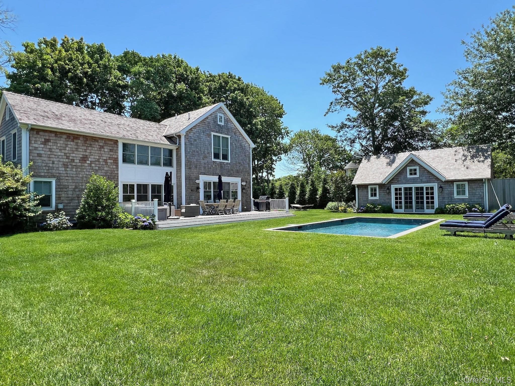 96 Miller Road Southampton, NY 11968 - Photo 12 of 18 a front view of a house with yard and green space